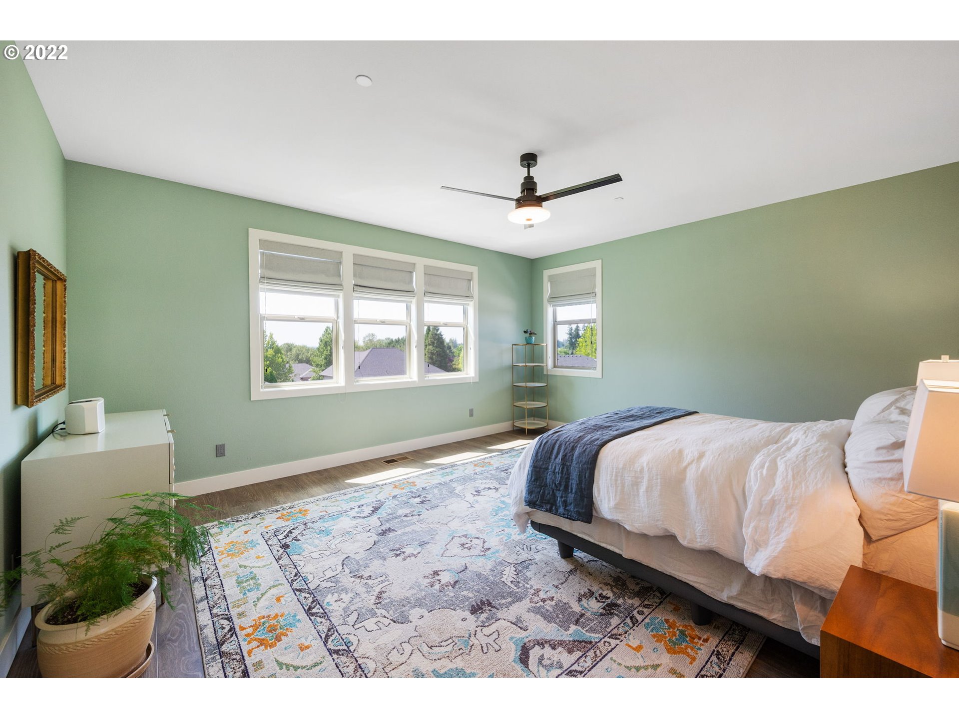 3865 Northwest Celebration Lane Camas, WA 98607 - Photo 16 of 32 a spacious bedroom with a bed and a window
