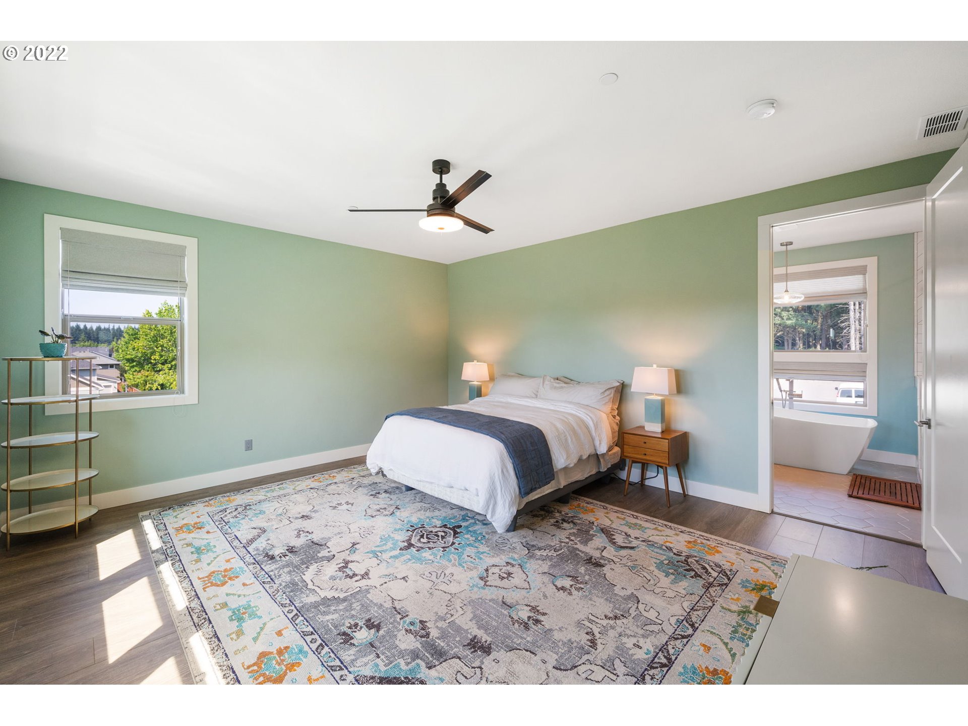 3865 Northwest Celebration Lane Camas, WA 98607 - Photo 17 of 32 a bedroom with a bed and wooden floor