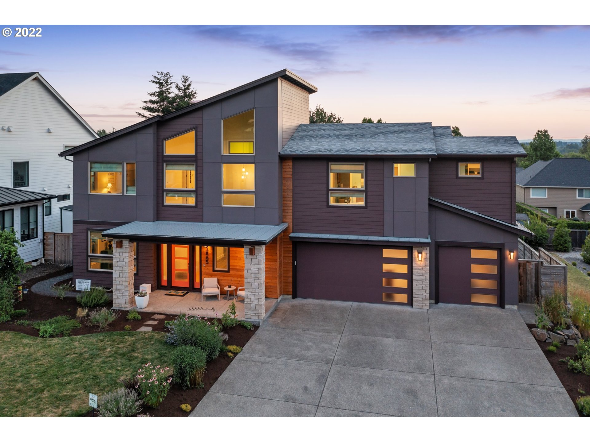 3865 Northwest Celebration Lane Camas, WA 98607 - Photo 2 of 32 a front view of a house with a yard