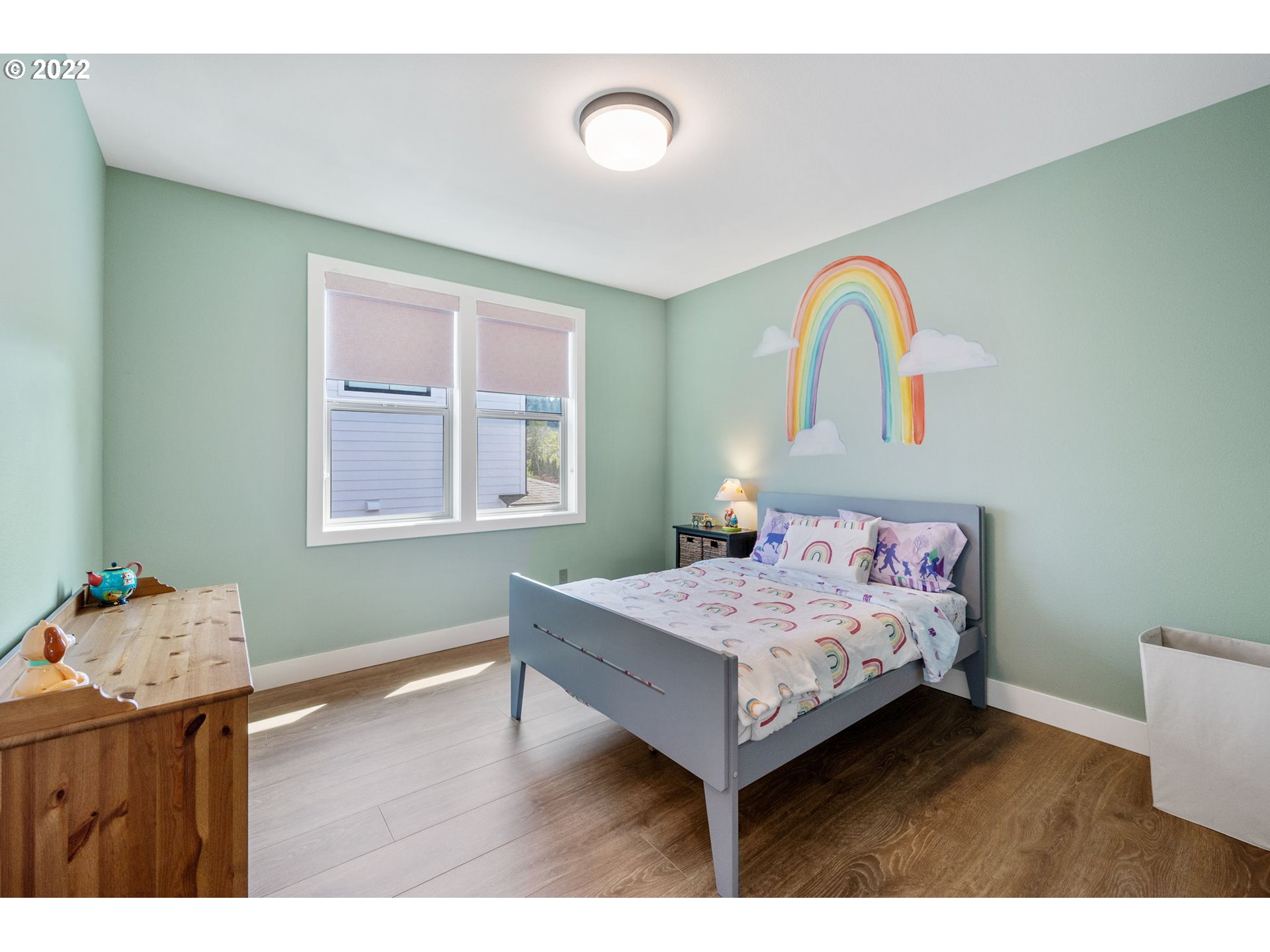 3865 Northwest Celebration Lane Camas, WA 98607 - Photo 25 of 32 a bedroom with a bed and a window