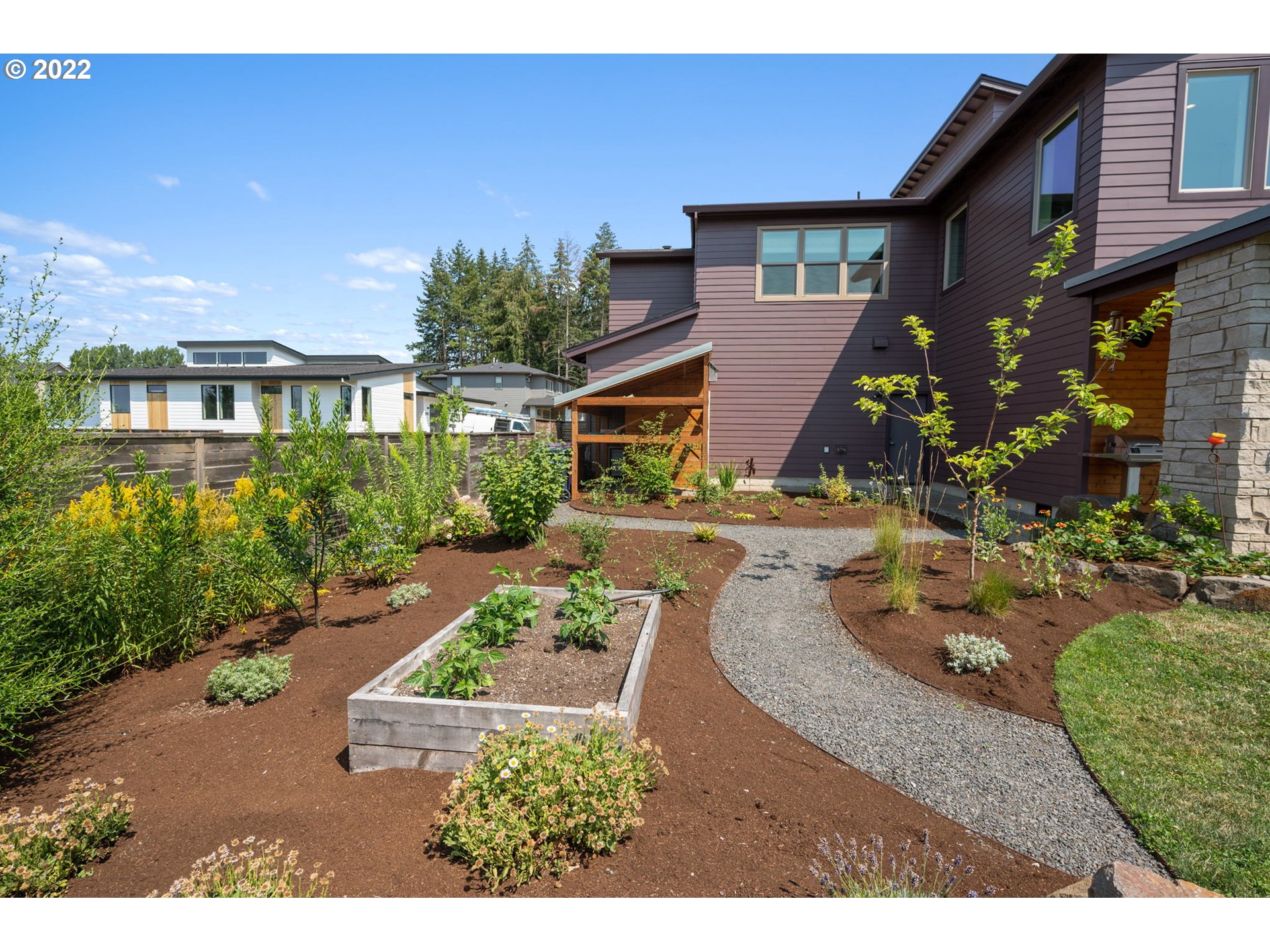 3865 Northwest Celebration Lane Camas, WA 98607 - Photo 30 of 32 a front view of a house with garden