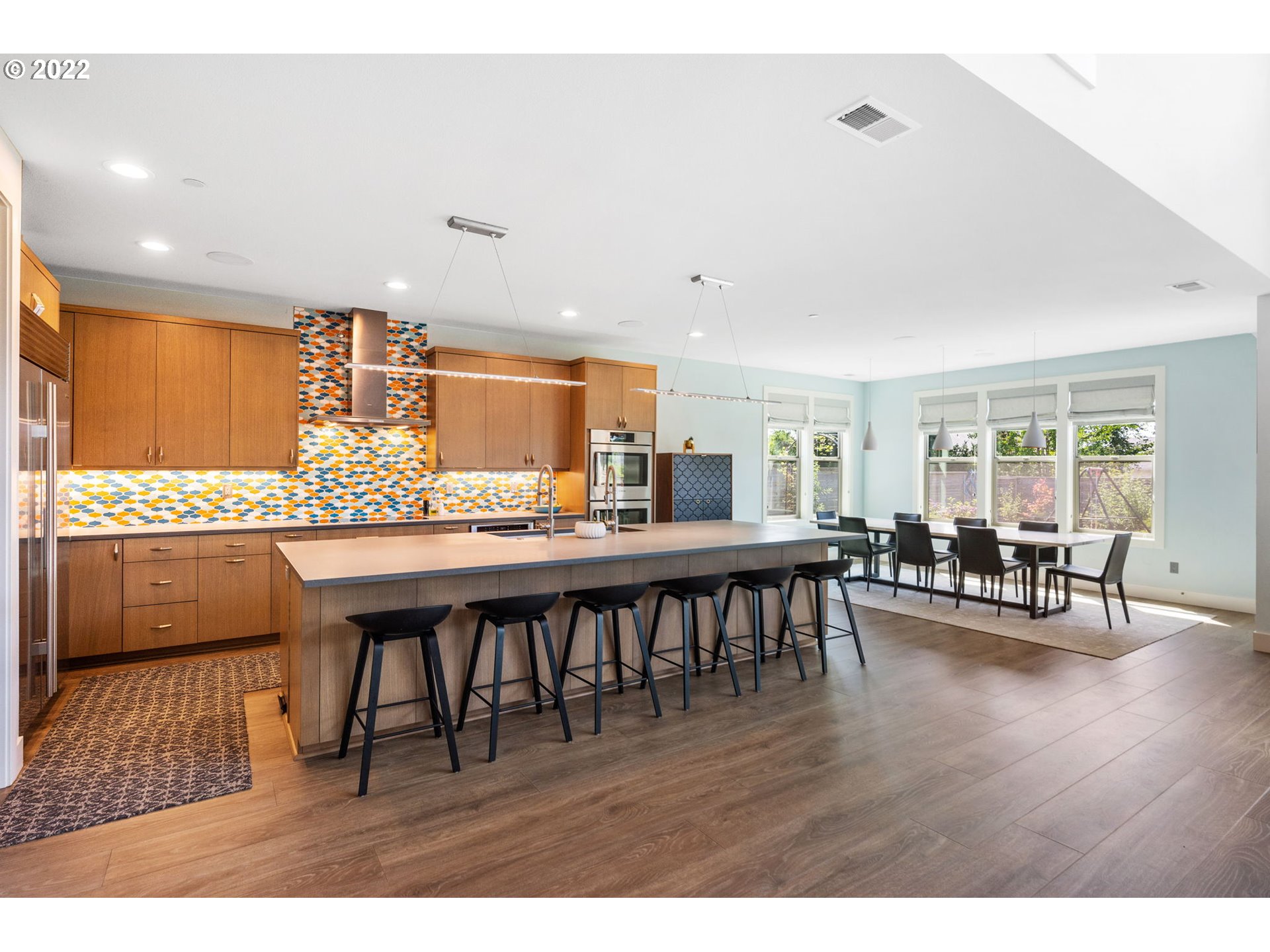 3865 Northwest Celebration Lane Camas, WA 98607 - Photo 8 of 32 a dining room with furniture and wooden floor