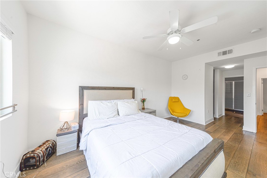 2976 Ripple Place, Unit 201 Los Angeles, CA 90039 - Photo 13 of 19 a bedroom with a bed and a couch