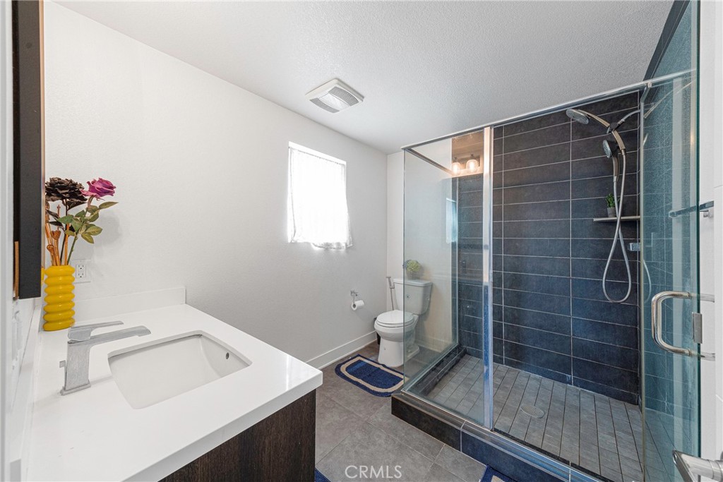 2976 Ripple Place, Unit 201 Los Angeles, CA 90039 - Photo 15 of 19 a bathroom with a sink and a shower