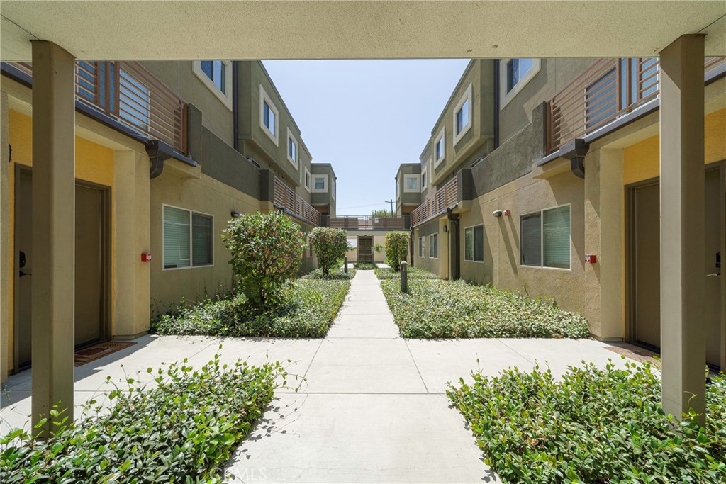 2976 Ripple Place, Unit 201 Los Angeles, CA 90039 - Photo 16 of 19 a view of a brick house with many windows
