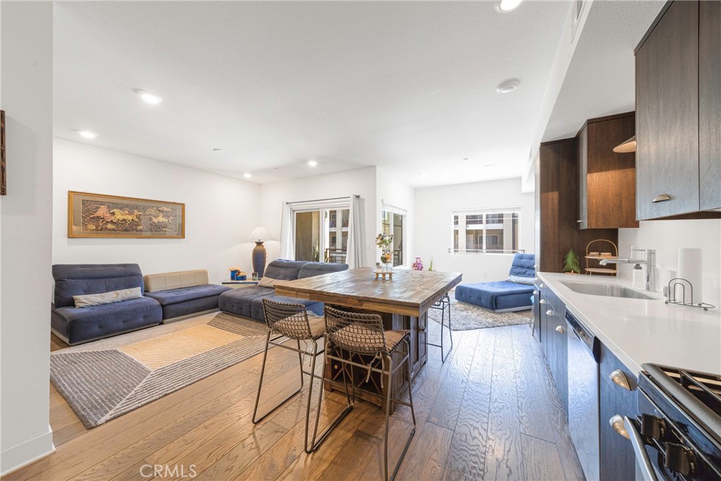 2976 Ripple Place, Unit 201 Los Angeles, CA 90039 - Photo 4 of 19 a living room with stainless steel appliances granite countertop furniture wooden floor and a kitchen view