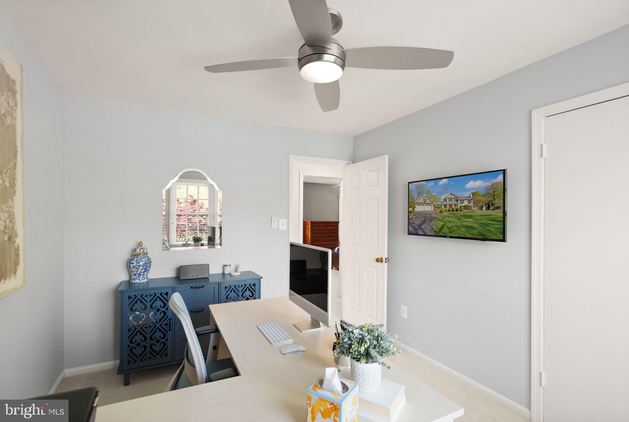 11809 Wayland Street Oakton, VA 22124 - Photo 43 of 97 a living room with furniture and a painting on the wall