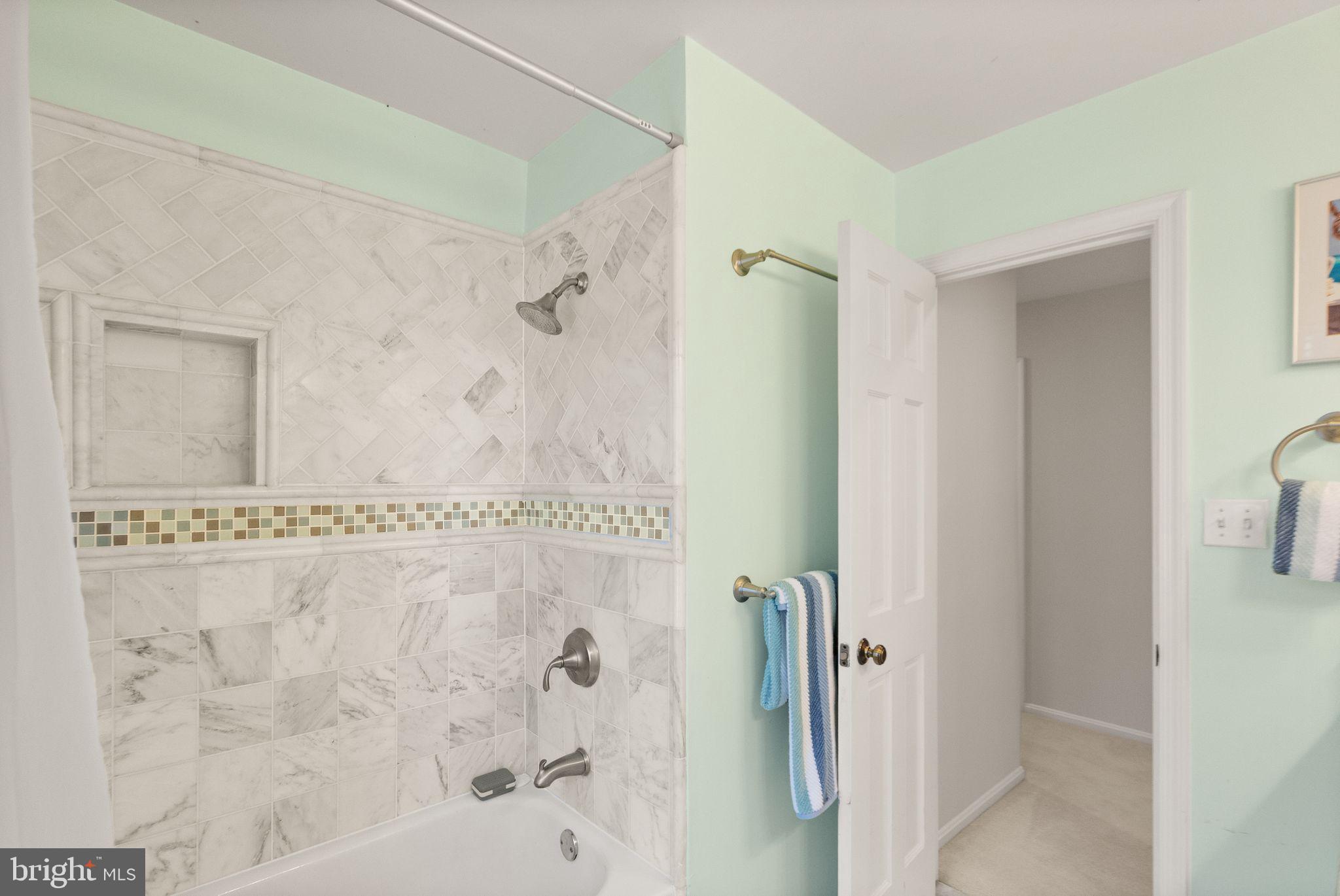 11809 Wayland Street Oakton, VA 22124 - Photo 49 of 97 a bathroom with a bathtub and shower