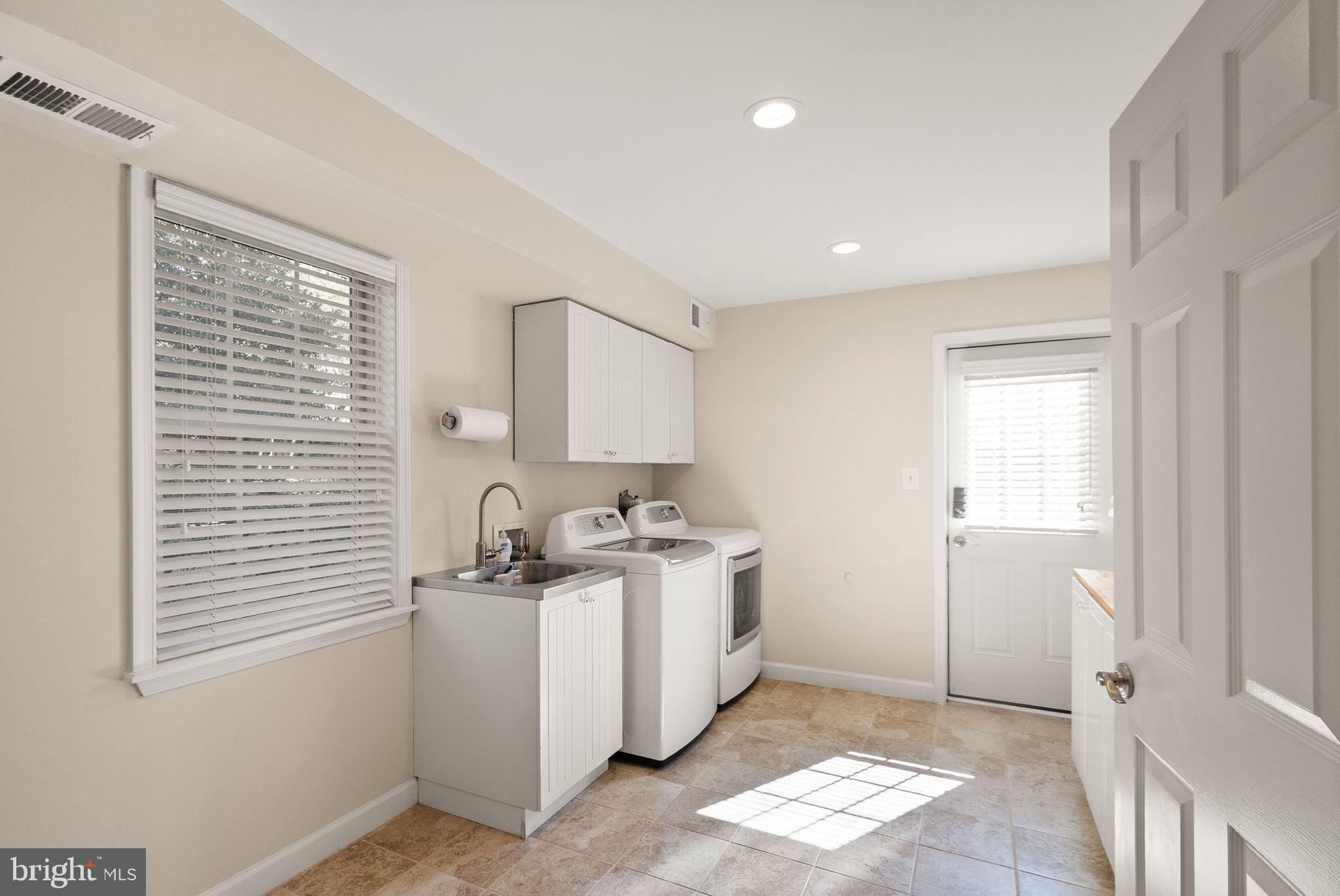 11809 Wayland Street Oakton, VA 22124 - Photo 53 of 97 a room with a sink a cabinets and entryway