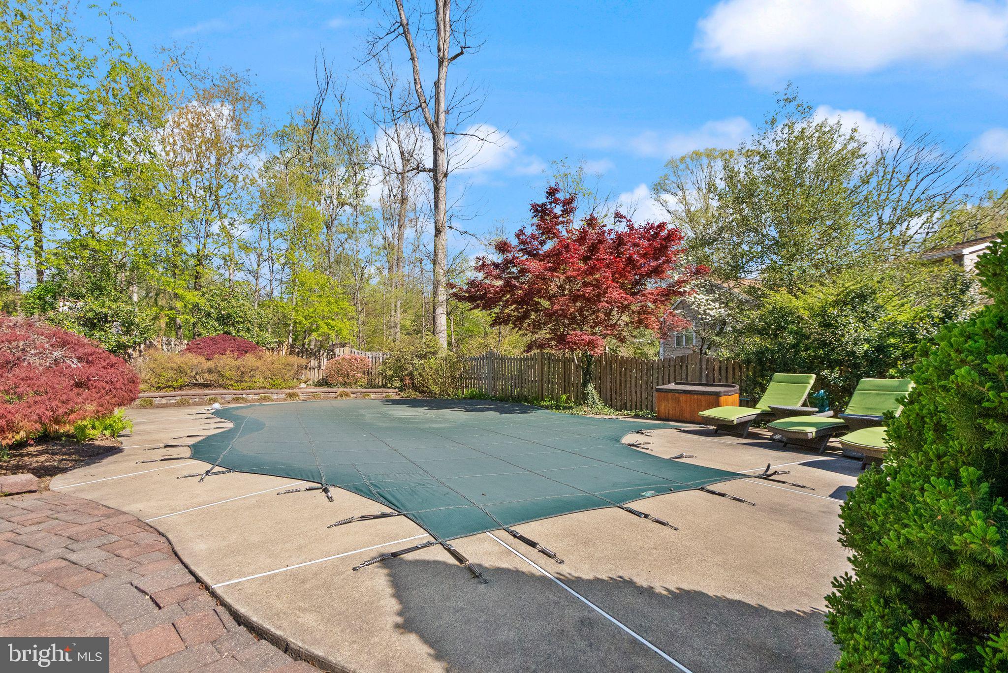 11809 Wayland Street Oakton, VA 22124 - Photo 65 of 97 a backyard of a house with table and chairs and potted plants
