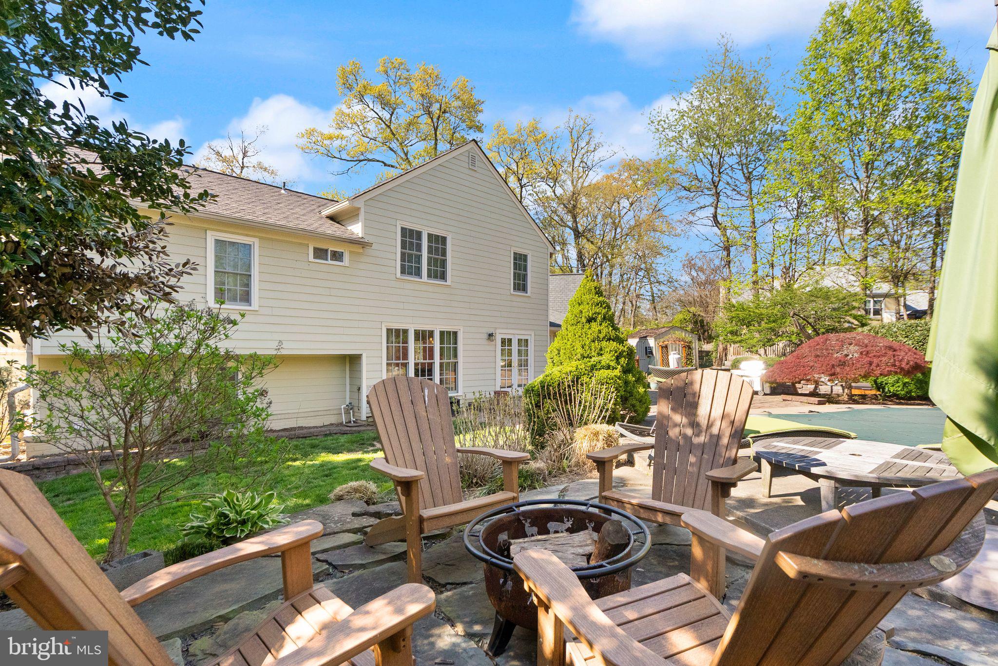 11809 Wayland Street Oakton, VA 22124 - Photo 68 of 97 a view of a chairs and table in backyard of the house
