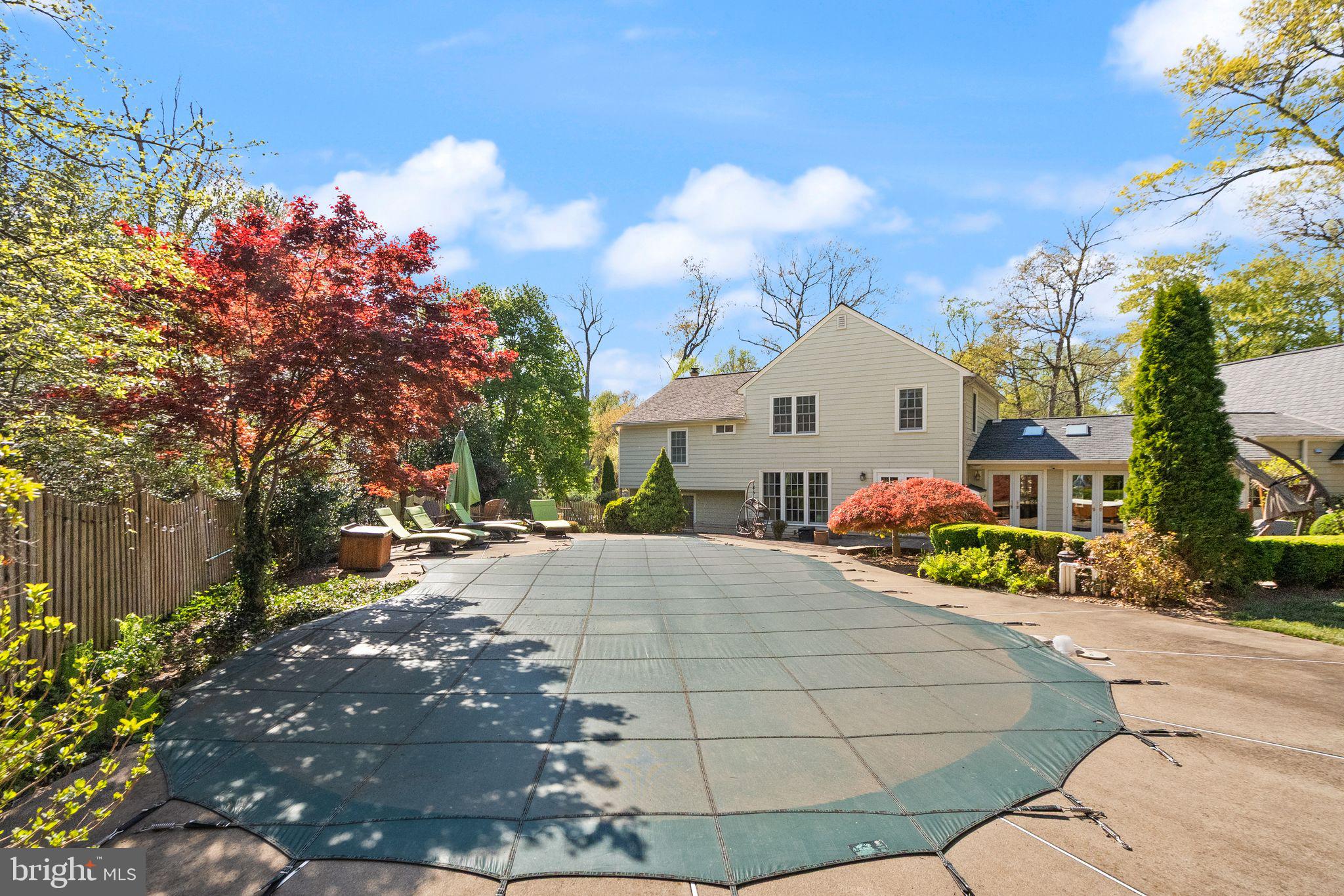 11809 Wayland Street Oakton, VA 22124 - Photo 70 of 97 a view of a white house with a yard