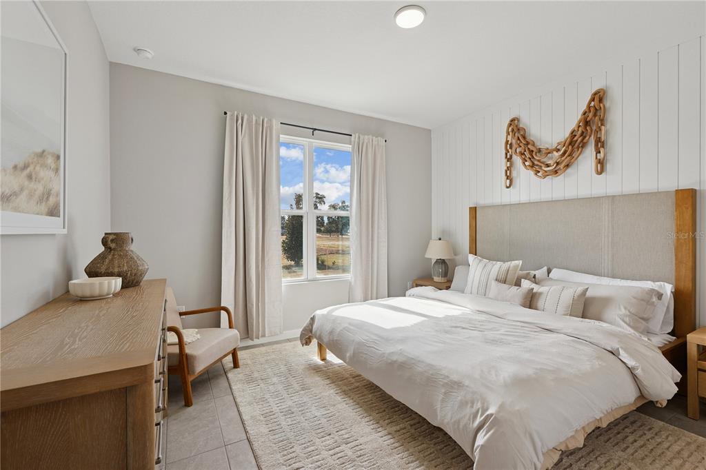 4474 Northwest 37th St Road Ocala, FL 34482 - Photo 13 of 16 a bedroom with a bed and a window