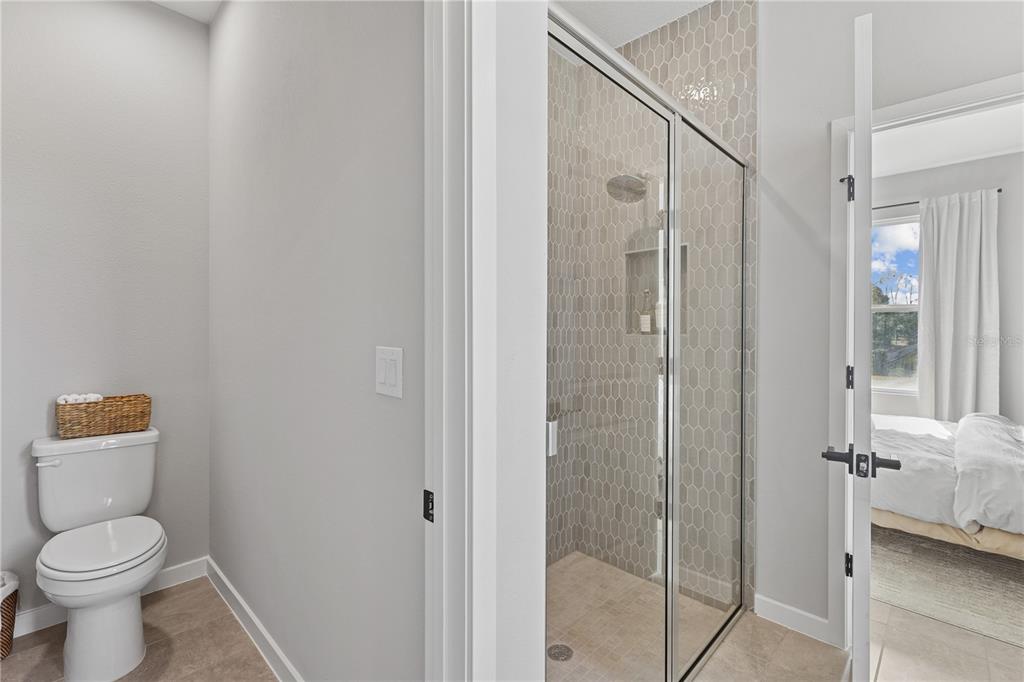 4474 Northwest 37th St Road Ocala, FL 34482 - Photo 15 of 16 a bathroom with a toilet and a shower