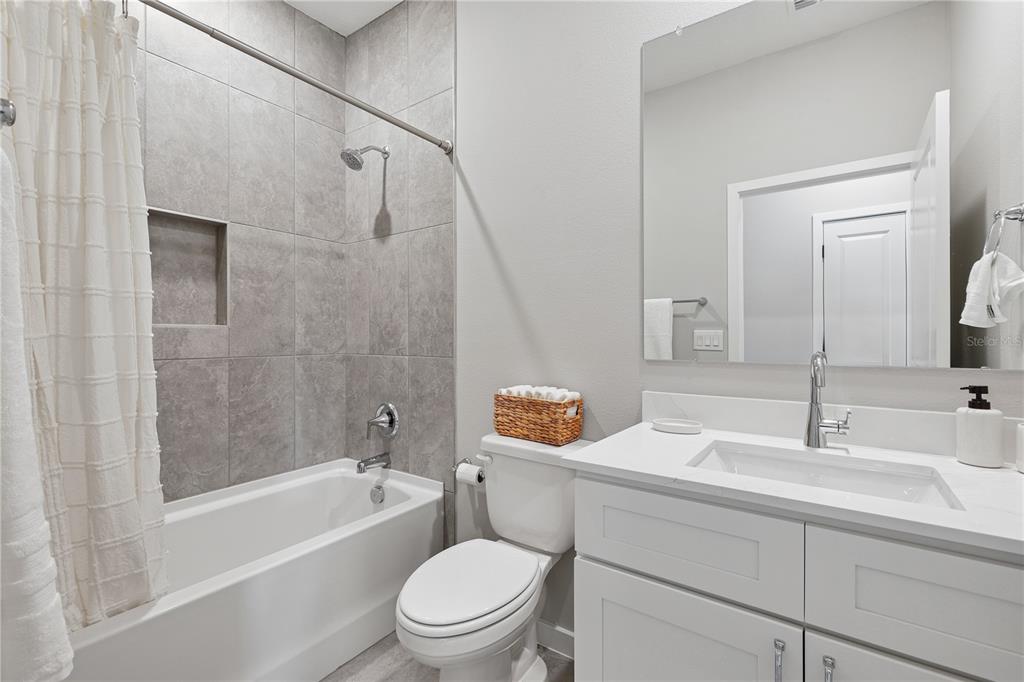 4474 Northwest 37th St Road Ocala, FL 34482 - Photo 5 of 16 a bathroom with a sink a toilet and shower