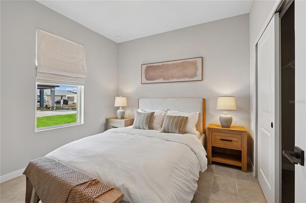 4474 Northwest 37th St Road Ocala, FL 34482 - Photo 7 of 16 a bedroom with a bed and a window
