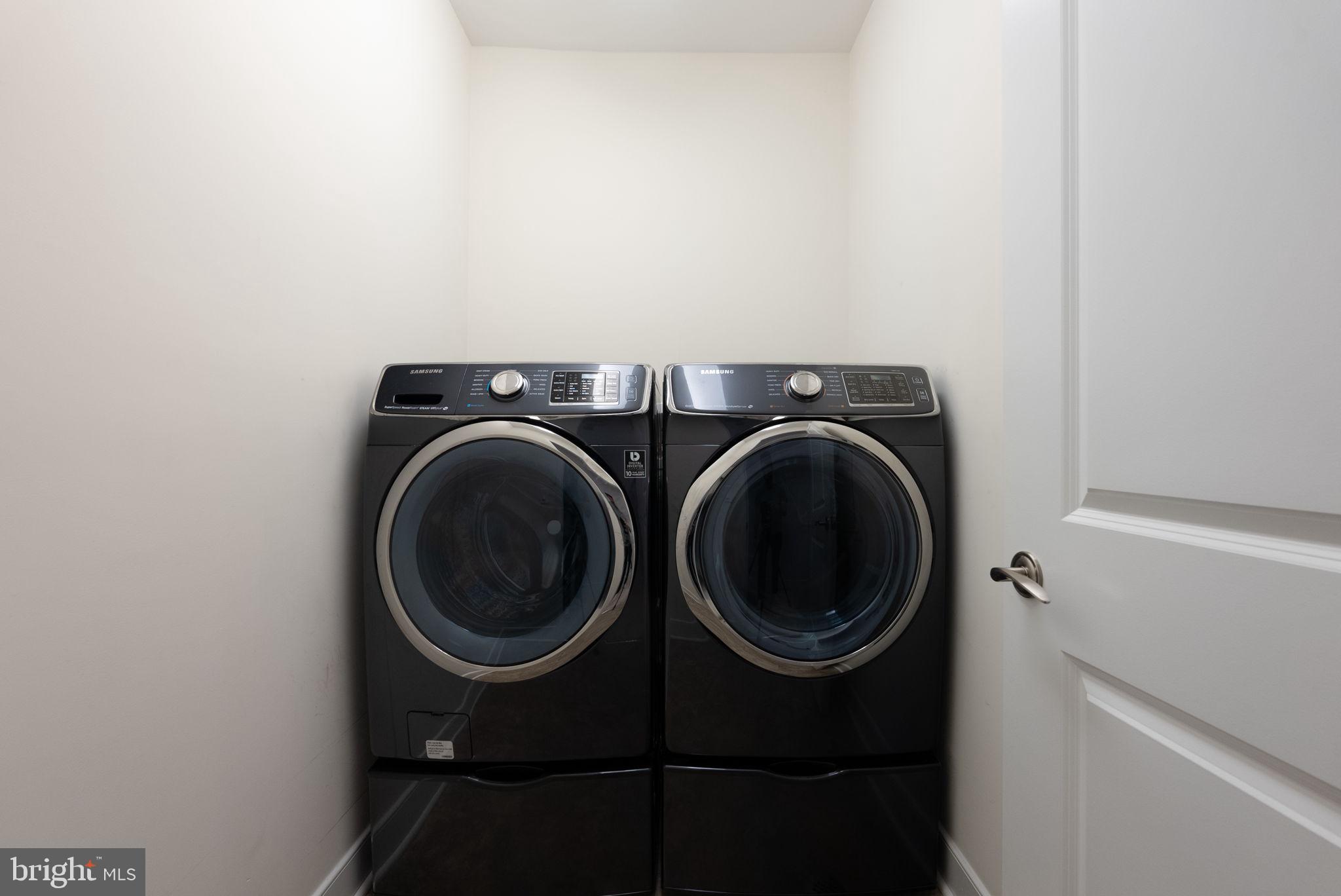 1418 North Rhodes Street, Unit B423 Arlington, VA 22209 - Photo 23 of 36 Bedroom level front loading washer and dryer