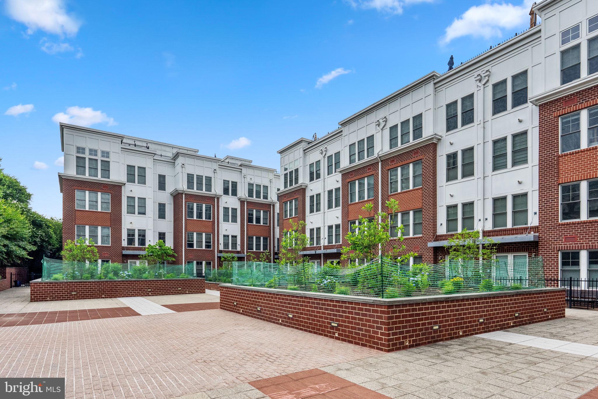 1418 North Rhodes Street, Unit B423 Arlington, VA 22209 - Photo 29 of 36 Outside courtyard where neighbors gather
