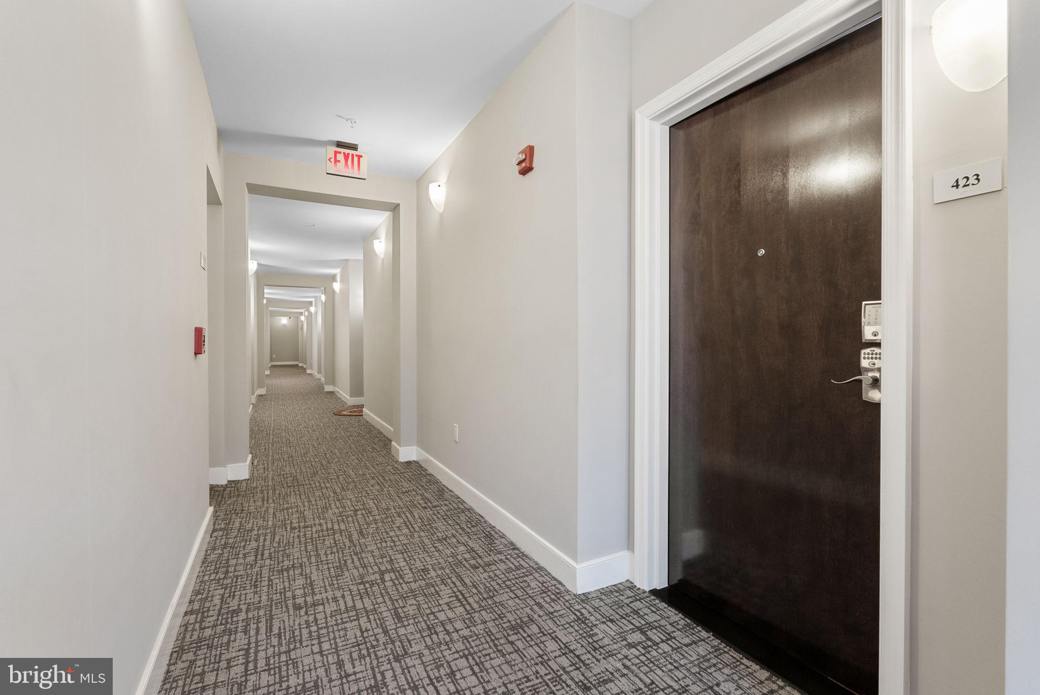 1418 North Rhodes Street, Unit B423 Arlington, VA 22209 - Photo 4 of 36 Entrance to condo from well list hallway