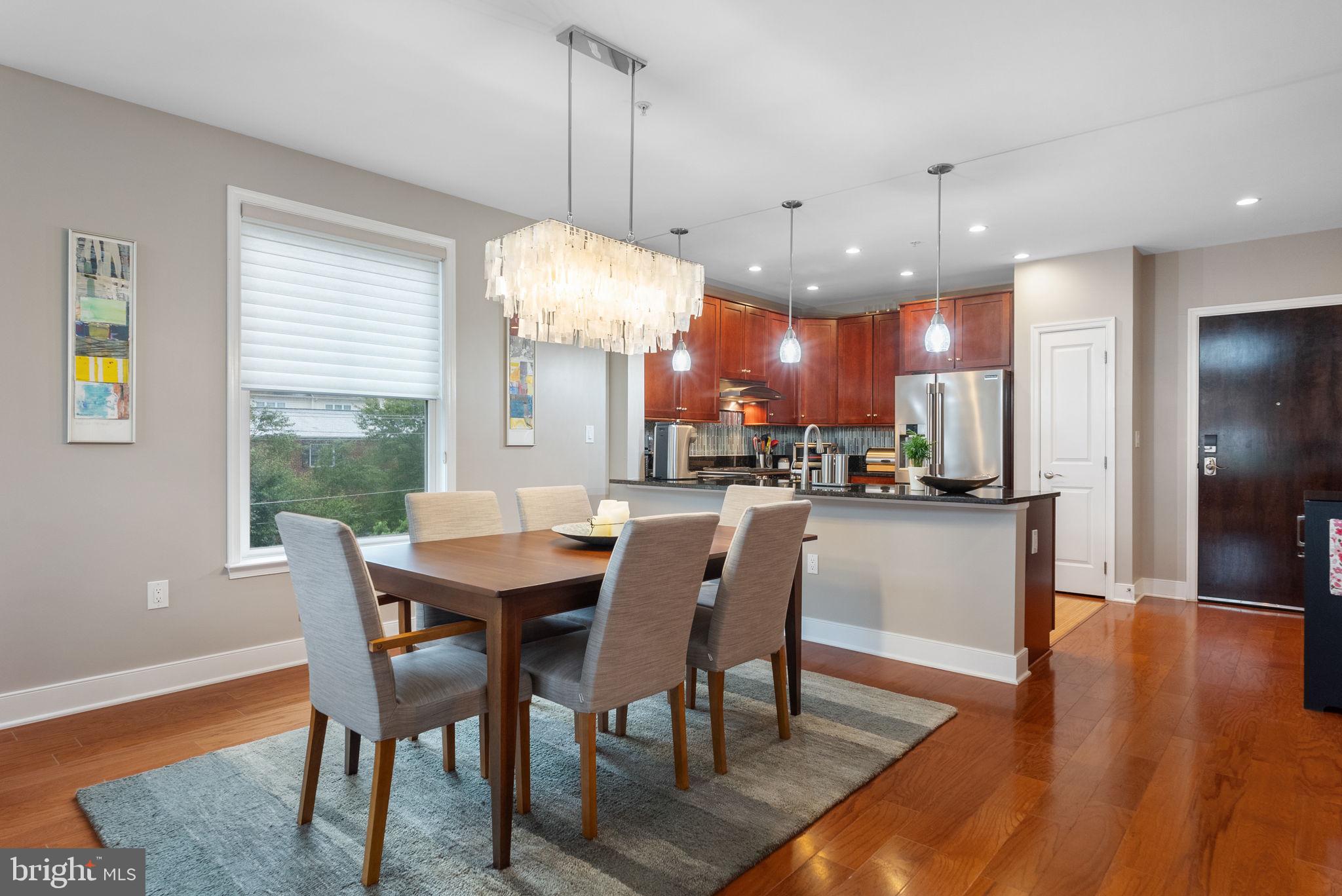 1418 North Rhodes Street, Unit B423 Arlington, VA 22209 - Photo 7 of 36 Dining area with elegant chandelier