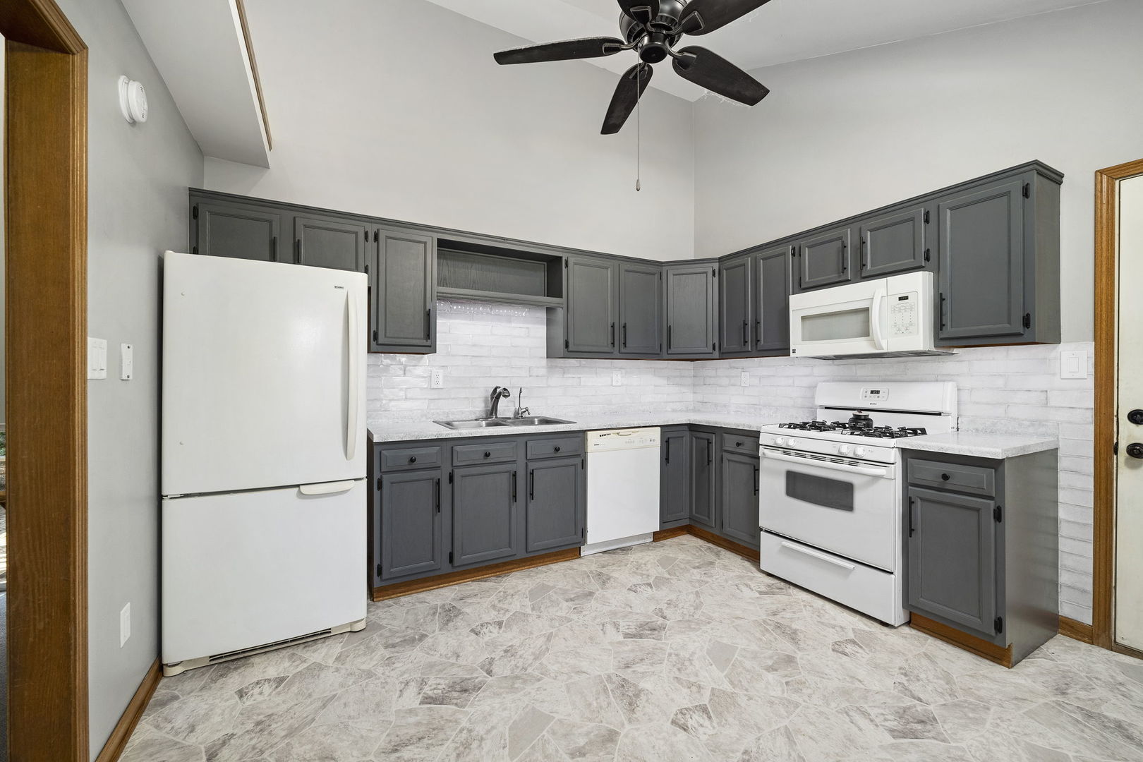 3778 East 2708th Road Sheridan, IL 60551 - Photo 8 of 32 a kitchen with stainless steel appliances granite countertop a refrigerator sink and stove
