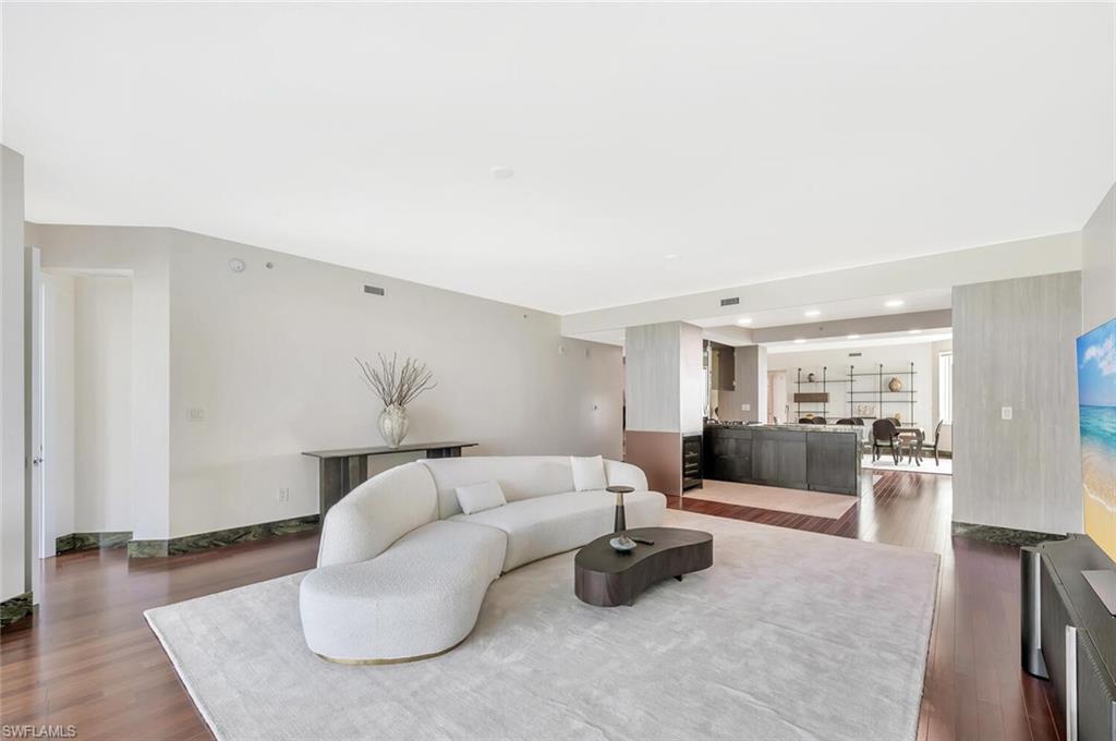 275 Indies Way, Unit 1605 Naples, FL 34110 - Photo 13 of 50 a living room with furniture and a couch