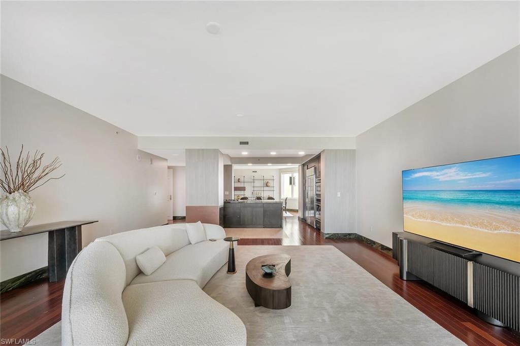 275 Indies Way, Unit 1605 Naples, FL 34110 - Photo 15 of 50 a living room with furniture and a flat screen tv