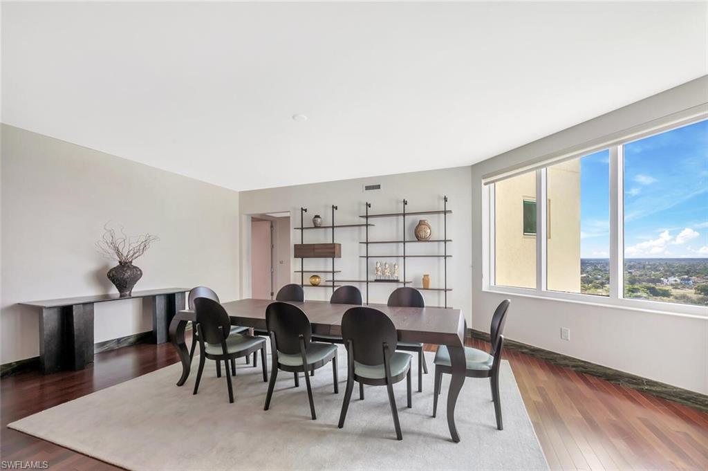 275 Indies Way, Unit 1605 Naples, FL 34110 - Photo 22 of 50 a view of a dining room with furniture window and wooden floor