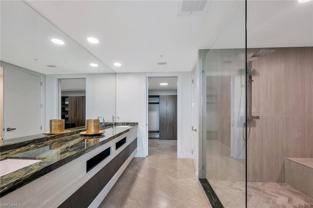 275 Indies Way, Unit 1605 Naples, FL 34110 - Photo 23 of 50 a kitchen with stainless steel appliances granite countertop a refrigerator and a sink