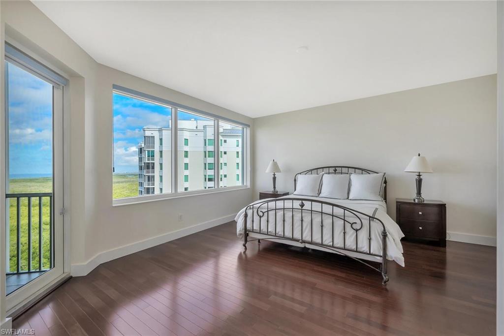 275 Indies Way, Unit 1605 Naples, FL 34110 - Photo 26 of 50 a bedroom with a bed and a window