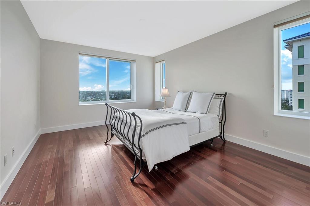 275 Indies Way, Unit 1605 Naples, FL 34110 - Photo 30 of 50 a bedroom with a bed and a window