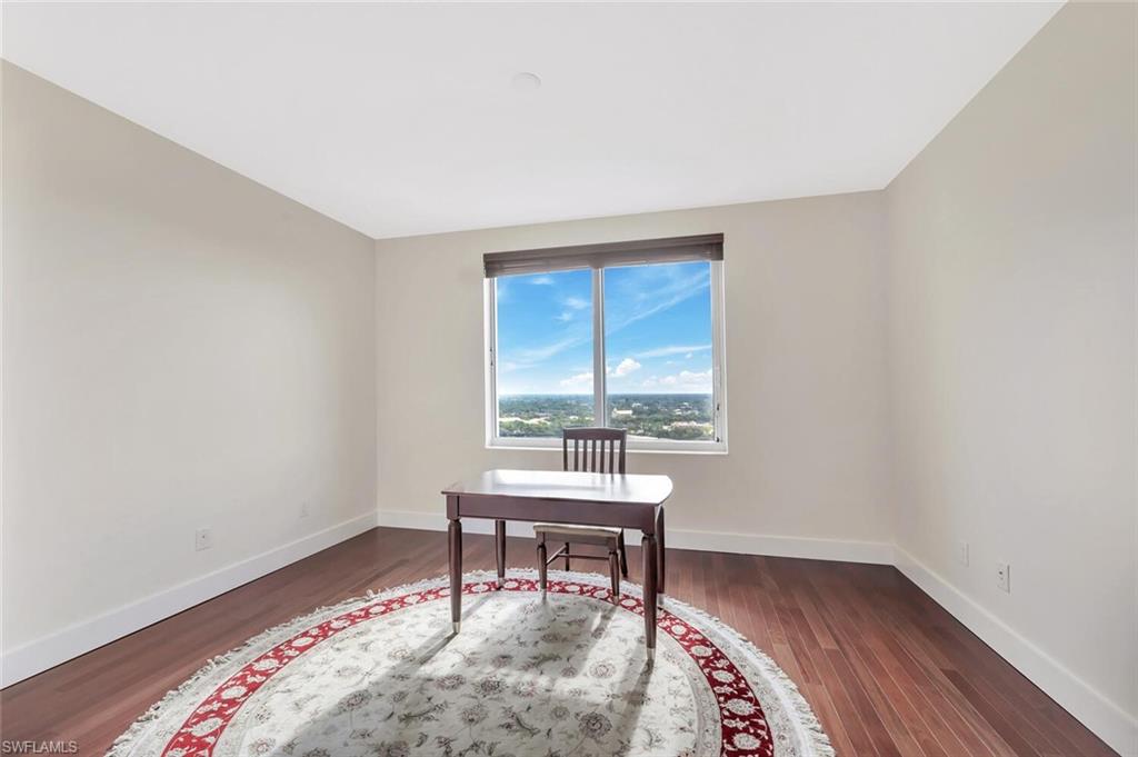 275 Indies Way, Unit 1605 Naples, FL 34110 - Photo 33 of 50 a room with a table and a window