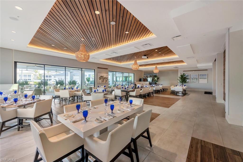 275 Indies Way, Unit 1605 Naples, FL 34110 - Photo 42 of 50 a very nice looking dining room with a large window
