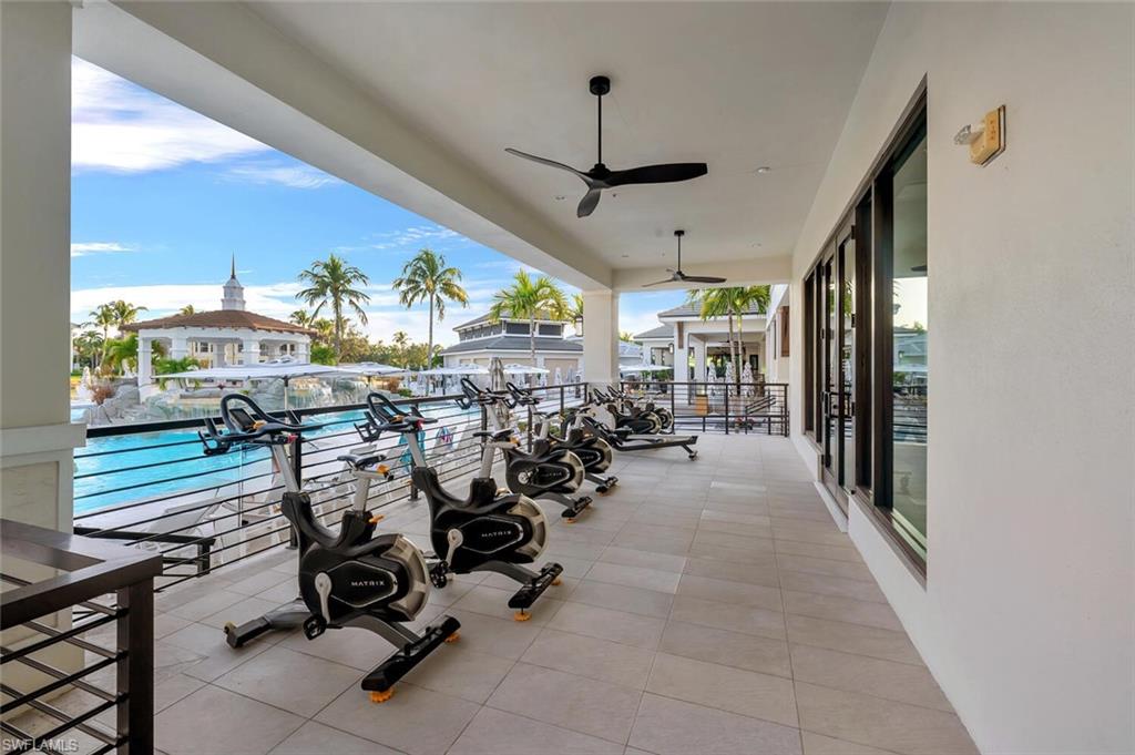 275 Indies Way, Unit 1605 Naples, FL 34110 - Photo 46 of 50 a view of a livingroom with furniture and floor to ceiling window