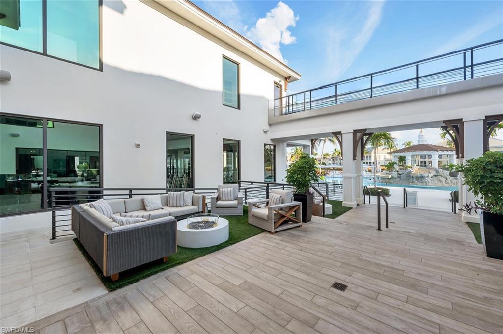 275 Indies Way, Unit 1605 Naples, FL 34110 - Photo 49 of 50 a living room with furniture and a large window