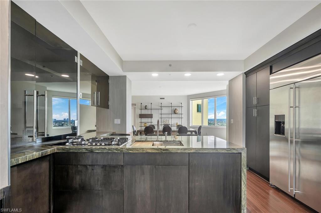 275 Indies Way, Unit 1605 Naples, FL 34110 - Photo 8 of 50 a bathroom with a sink and a mirror