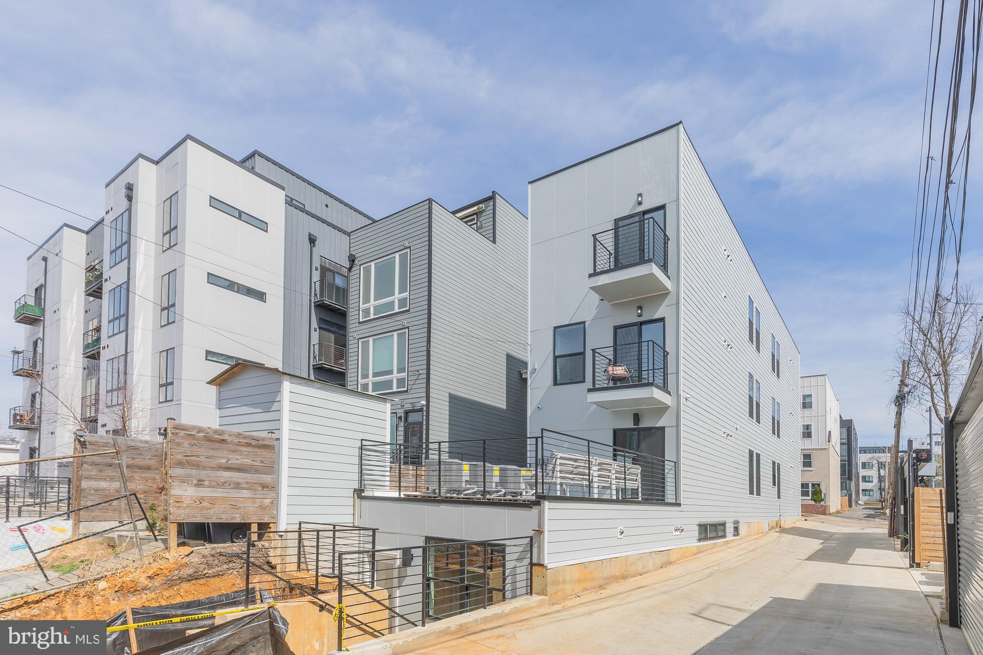 1012 17th Place Northeast, Unit 1 Washington, DC 20002 - Photo 18 of 18 a front view of a building with a street