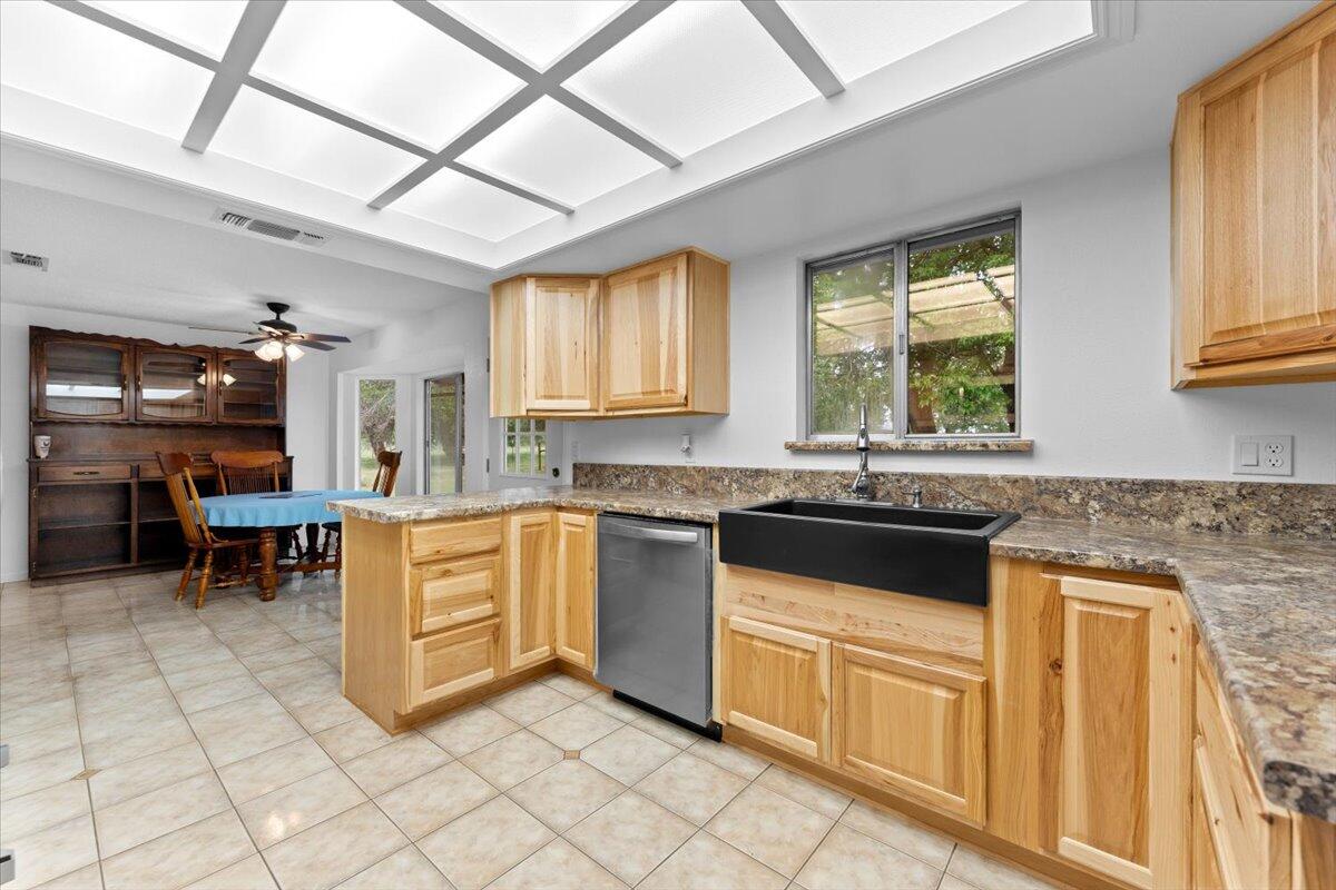 5210 Balls Ferry Road Anderson, CA 96007 - Photo 13 of 68 a kitchen with granite countertop a sink cabinets and window