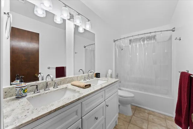 a utility room with sink dryer and washer