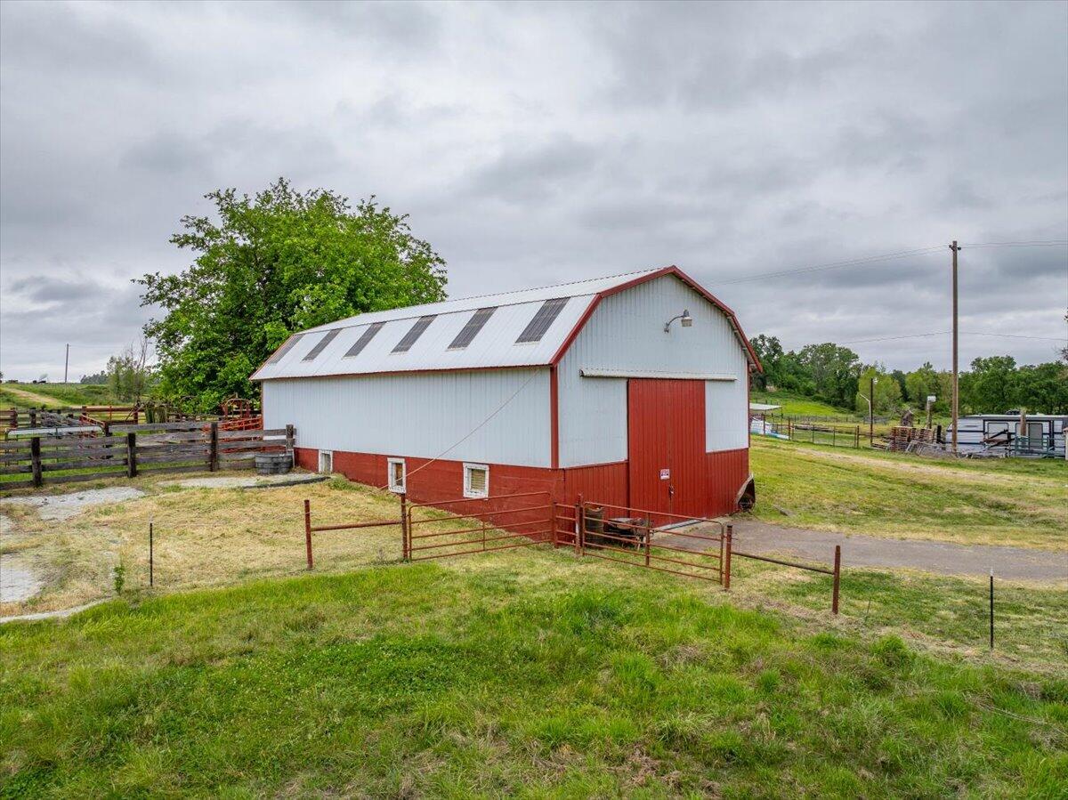 5210 Balls Ferry Road Anderson, CA 96007 - Photo 38 of 68 a view of a house with a yard and sitting area