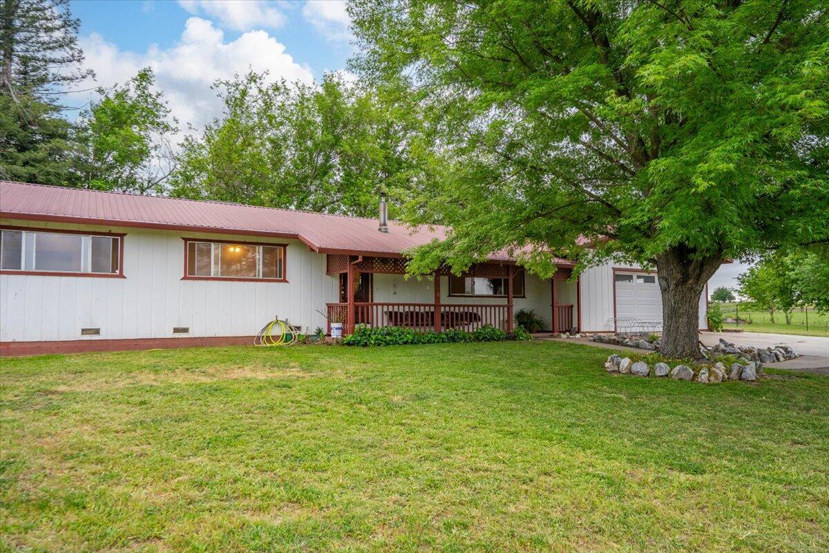 5210 Balls Ferry Road Anderson, CA 96007 - Photo 54 of 68 a backyard of a house with table and chairs