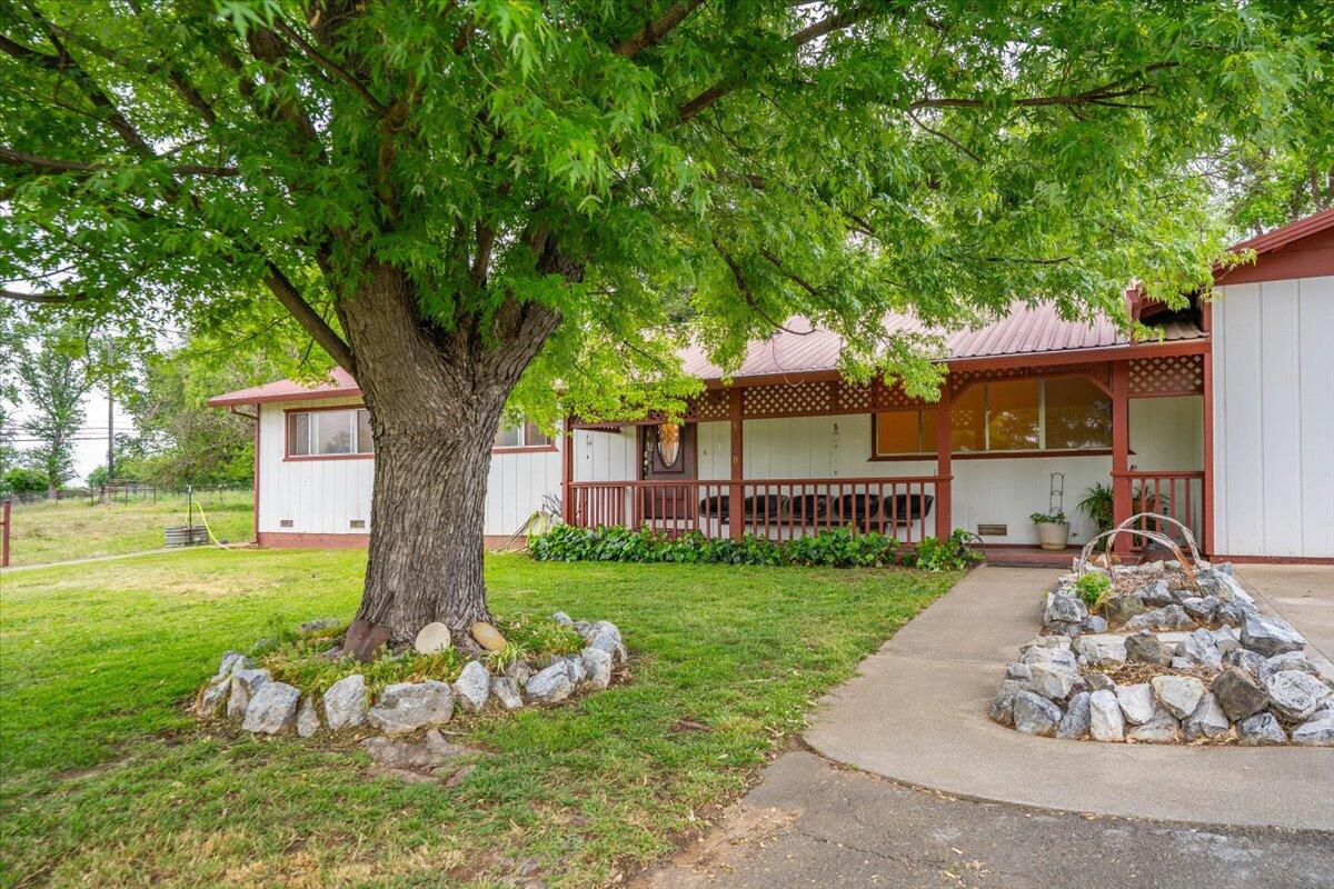 5210 Balls Ferry Road Anderson, CA 96007 - Photo 56 of 68 a front view of a house with garden