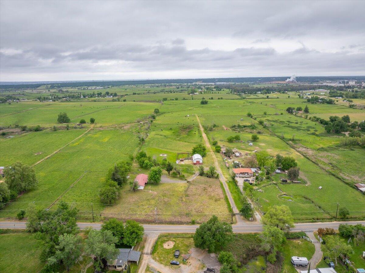5210 Balls Ferry Road Anderson, CA 96007 - Photo 62 of 68 an aerial view of a city with lots of residential buildings ocean and mountain view in back