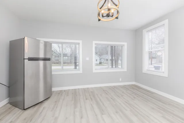 a view of kitchen with furniture wooden floor and window