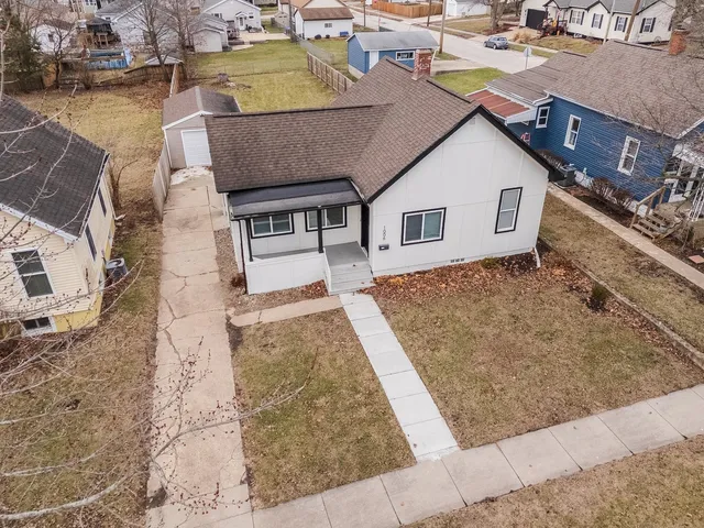 a view of residential houses with outdoor space