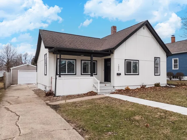 a front view of a house with trees