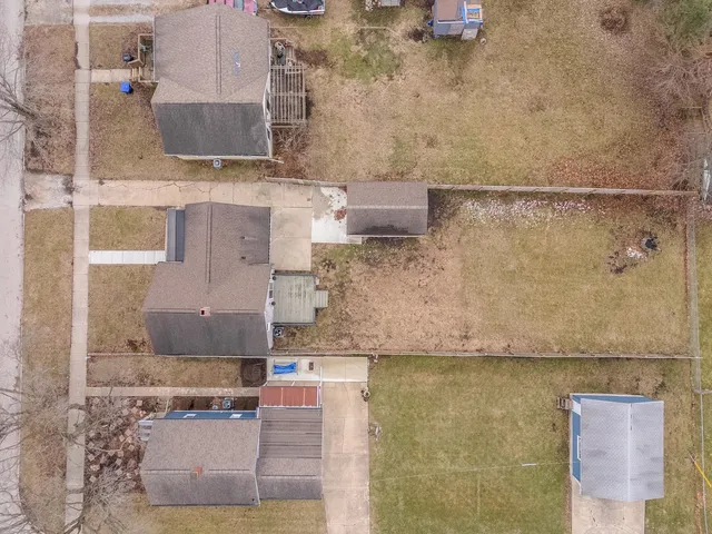 an aerial view of residential house with outdoor space