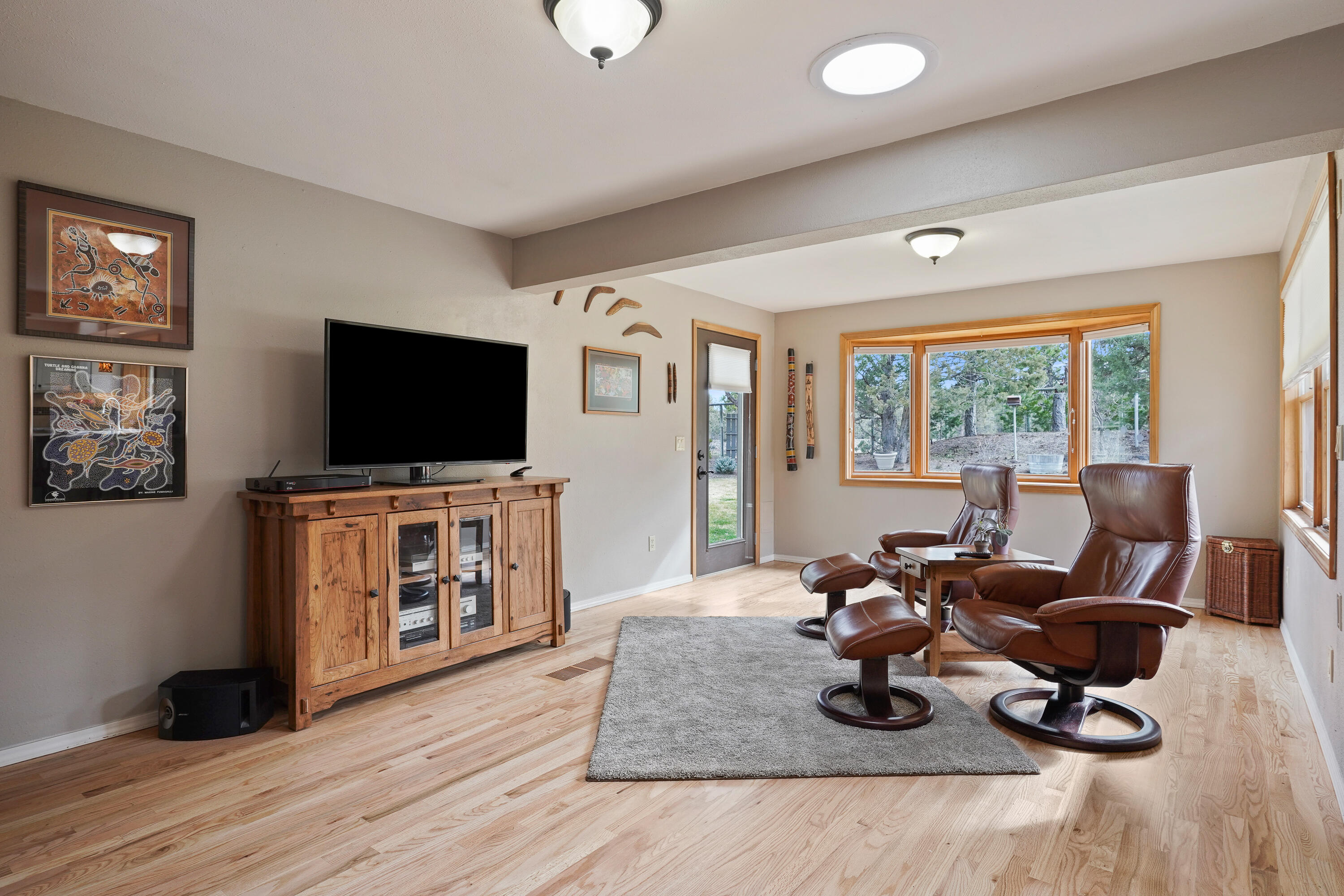 70030 Meadow View Road Sisters, OR 97759 - Photo 13 of 43 a living room with furniture and a flat screen tv