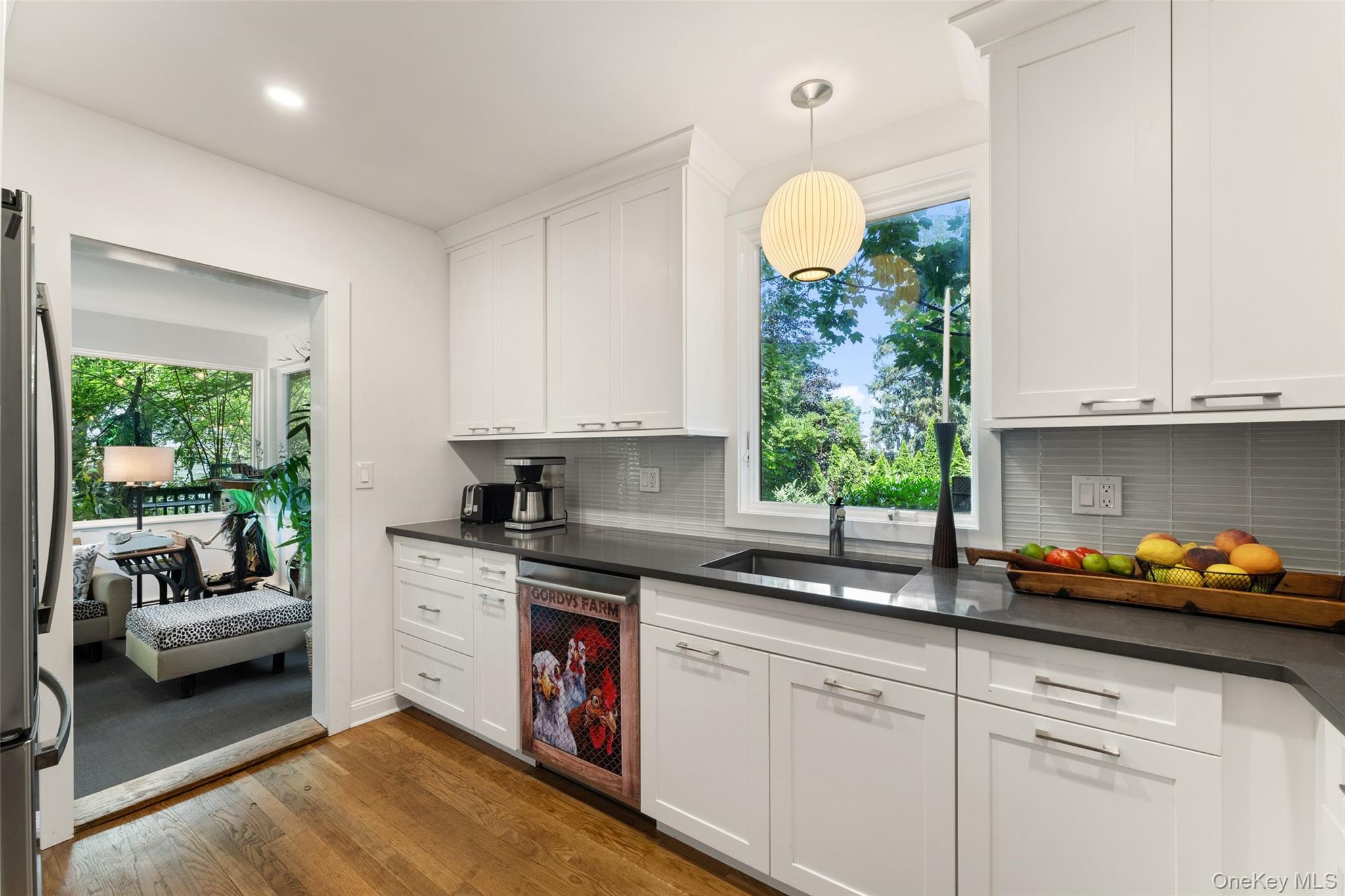 5 Coralyn Road Scarsdale, NY 10583 - Photo 11 of 44 a kitchen with stainless steel appliances granite countertop a sink a stove and a white cabinets