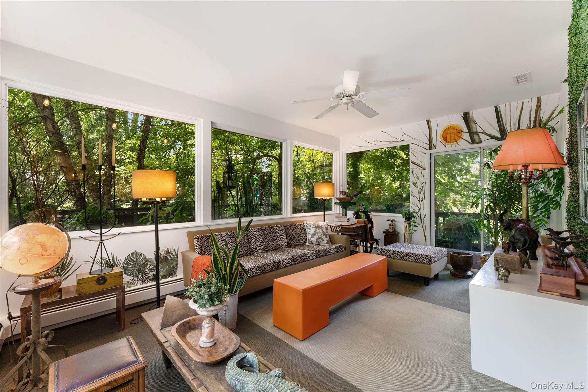 5 Coralyn Road Scarsdale, NY 10583 - Photo 13 of 44 a living room with patio furniture and a potted plant